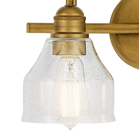 Close-up of Avery 14.75 Inch Two-Light Vanity Light With Clear Seeded Glass In Olde Bronze, whimsical asymmetrical fixture.