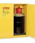 Heavy Duty 110 Gallon Flammable Safety Cabinet Built Tough For Two 55 Gallon Drums showing interior with black drums and red safety cans.