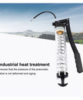 Heavy Duty 600cc Manual Oil Gun for Lubrication with copper nozzle and stainless steel spring against landscape background