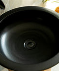 Slick Ceramic Vessel Sink With Retro Industrial Pedestal Basin Design High Gloss Scratch Resistant Glaze top view of black basin.