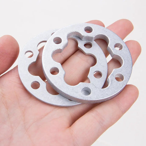 4 Pcs Aluminum E Bike Disc Brake Spacer Kit 6 Hole Universal Rotor Washers 2mm and 5mm in hand, showcasing design and holes.