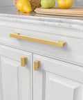Close-up of 10 Pack Brushed Brass Cabinet Pulls With 9 Inch Hole Centers For Kitchen Cabinets Cupboards And Drawers Easy Install Heavy Duty Durable Zinc Alloy Construction With A Slick Timeless Finish ZH00013 on white cabinet drawers