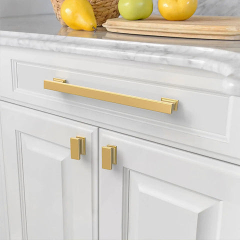 Close-up of 10 Pack Brushed Brass Cabinet Pulls With 9 Inch Hole Centers For Kitchen Cabinets Cupboards And Drawers Easy Install Heavy Duty Durable Zinc Alloy Construction With A Slick Timeless Finish ZH00013 on white cabinet drawers