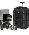 Pro Trekker RLX 450 AW II 28L Camera Roller Backpack with DSLR camera, lenses, laptop, and tablet, black design