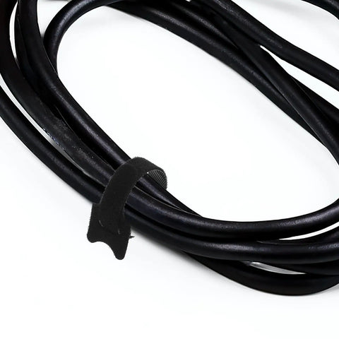 150 Piece Cat Head Cable Management Straps Heavy Duty Nylon Wire Ties holding black cables neatly bundled.