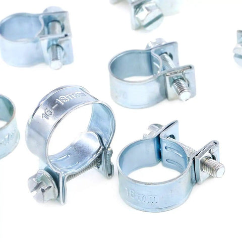 Close-up of 92 Piece Zinc Plated Mini Fuel Injection Line Style Hose Clamp Set 10 Sizes Perfect For Auto Farm Plant And Construction Jobs Pro Grade Heavy Duty Rust Resistant Clips For A Tight Fit, showing various clamps in a bright setting