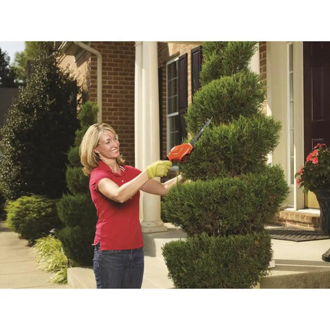 Person using Cordless Shrub Trimmer And Grass Shear Combo, Lightweight Three Point Six Volt Lithium Battery for pruning