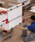 Heavy Duty 31 Inch Fixed Jaw Parallel Clamp Boasts Rock Solid Zero Sag Grip With Non Marking Pads being used for woodworking.