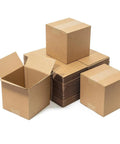 Set Of 100 Small 4x4x4 Inch Kraft Corrugated Mail Boxes For Shipping And Packing, stacked and ready for use.