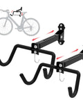 Heavy Duty Steel Bike Wall Mount Hanger For Garage Storage Foldable Arm Bike Rack Indoor Wall Mount Holder Fits Road And Mountain Bikes Adjustable Sturdy Up To 55 Lbs 2 Pack, showing two black metal hooks with wall brackets and foldable arms.