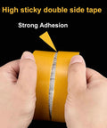 Hands pulling apart No Sew No Iron Hem Tape Duo Pack With 1 Inch And 2 Inch Rolls 39 Feet Each Heavy Duty Double Sided Mounting Tape Ultra Strong.