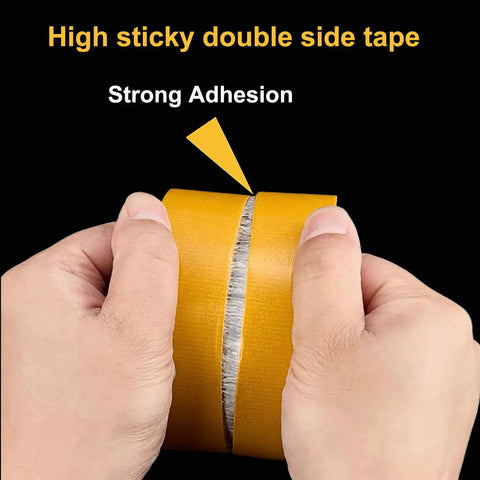 Hands pulling apart No Sew No Iron Hem Tape Duo Pack With 1 Inch And 2 Inch Rolls 39 Feet Each Heavy Duty Double Sided Mounting Tape Ultra Strong.