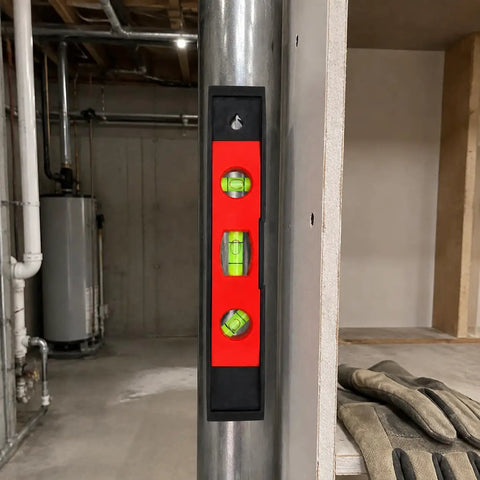 Spirit Level, 3, 30CM shown vertically against a metal pole, featuring three bubble vials for accurate leveling.