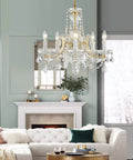 Glam Crystal Chandelier In Gold Finish With 5 Lights, Maria Theresa Style K9 Crystals, above modern living room setting