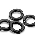 Close-up of 304 stainless steel Three Eighths Inch Split Lock Washers Set Of 50 with black oxide finish on white background