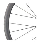 Close-up of 50mm Carbon Clincher Wheelset For 700C Road Bikes Tubeless Ready With Laser Brake Surface and Pillar 1423 Spokes.