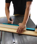 Person using Table Saw Miter Gauge Extension Fence System With Aluminum Miter Extension Fence Telescoping Fence And Flip Stop Ready To Extend From 16 To 24 Inches With 27 Locking Stops For Precise Angles on wood board