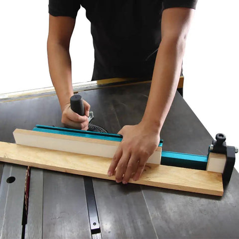 Person using Table Saw Miter Gauge Extension Fence System With Aluminum Miter Extension Fence Telescoping Fence And Flip Stop Ready To Extend From 16 To 24 Inches With 27 Locking Stops For Precise Angles on wood board