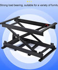 Heavy Duty Adjustable Electric Scissor Lift Table With Foldable Design For Easy Storage And Remote Control Operation To Handle Heavy Loads Smoothly, showing black metal frame.