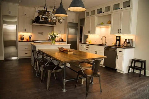 Spacious kitchen featuring Top Shelf Golden Oak Reactive Wood Stain cabinetry, rustic wood dining table, and modern appliances.