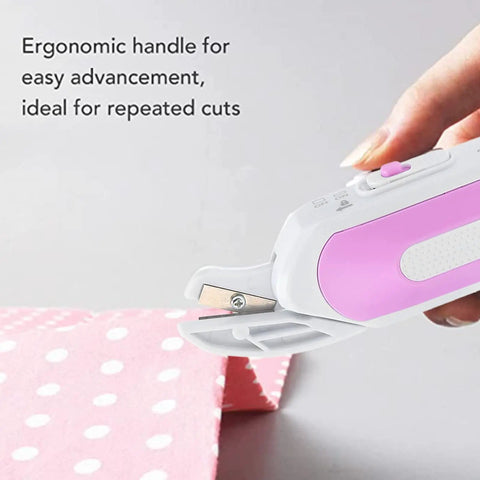 Top Shelf Electric Mini Scissors For Sewing And Crafting Cordless Portable Shears With Ergonomic Handle, cutting pink polka dot fabric.