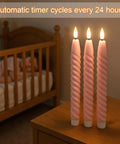 Pink Flameless Taper Candles Real Wax With Remote Timer 6 Pack 9.8 Inch LED Spiral on nightstand near crib