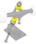 Skateboard And Longboard Truck Replacement Bushings Four Pack For Two Trucks USA Made With Multiple Colors And Durometers 88A To 99A Including 94A Yellow For Softer Or Stiffer Ride And Smoother Turns, showing yellow bushings on skateboard truck.