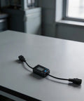 Straight Up Reliable EV Charger Detector And Voltage Current Tester For Electric Vehicles KWS DC22 on a gray table.