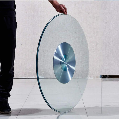 Rotating Lazy Susan Turntable With Glass Top And Silent Bearing, heavy-duty metal tray shown upright by a person.