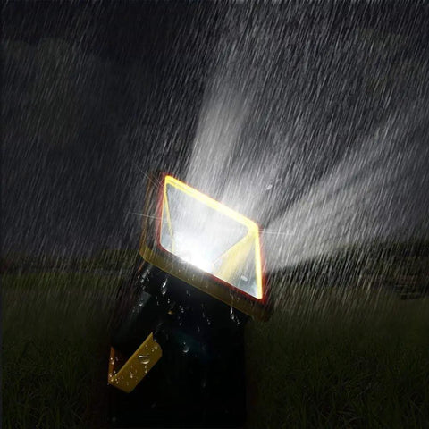Magnetic 30W LED Work Light with 1200 Lumens in rain showing waterproof design and 180-degree rotatable head for hands-free use.