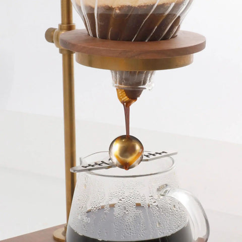 Coffee Ice Sphere Maker Stainless Steel Ball Mold under drip brewing setup for barista-grade cold brew iced coffee