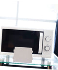 Microwave Waveguide Cover Mica Sheet Replacement For Ovens displayed in front of a white microwave with control knobs.