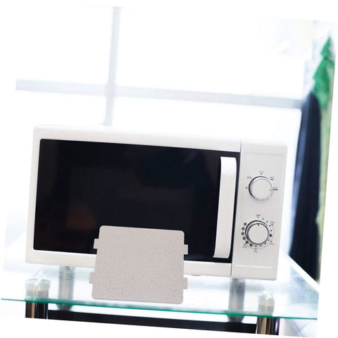Microwave Waveguide Cover Mica Sheet Replacement For Ovens displayed in front of a white microwave with control knobs.