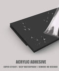 Close-up of acrylic adhesive on black surface showing water resistance, peel and stick feature of Door Draft Stopper For Large Gaps 3 Inch Wide Door Bottom Seal 37 Inch Long Fits Interior Exterior And Garage Doors Seals Gaps Up To 1.4 Inches Keeps Dust Noise Light And Pests Out Easy Peel And Stick Adhesive.