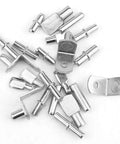 Assorted zinc alloy shelf pins with 100 Piece Shelf Pins And Pegs Assortment For Wood Shelves And Cabinets 10 Styles in various shapes and sizes.
