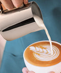 Pouring milk into coffee with Complete Home Coffee Frother Set With Upgraded Ultra Stand Barista Grade Handheld Milk Foam Maker
