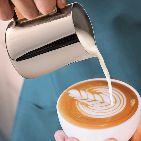 Pouring milk into coffee with Complete Home Coffee Frother Set With Upgraded Ultra Stand Barista Grade Handheld Milk Foam Maker