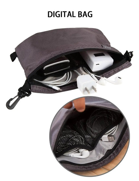 Open On The Go Dopp Kit Toiletry Bag For Men Water Repellent Nylon Travel Pouch With Internal Mesh Pockets containing cords and charger
