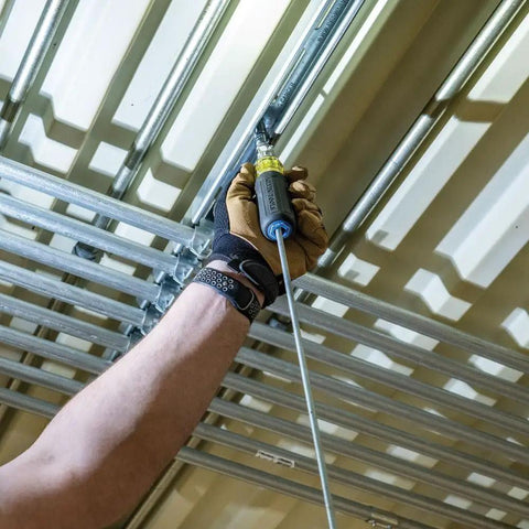 Using the All Purpose 4 Piece Multi Bit Screwdriver And Nut Driver Set With 30 Industrial Strength Bits on overhead metal structure.
