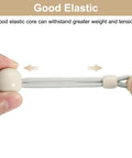Hands stretching beige 12 Pack 4 Inch Bungee Tie Downs For Exterior Roller Shades And Sun Shades, showing elasticity and strength.