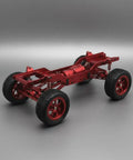 Red 12-Scale RC Aluminum Alloy Chassis Kit For DIY Electric Car Build showing metal frame, wheels, and sturdy gearbox axles.