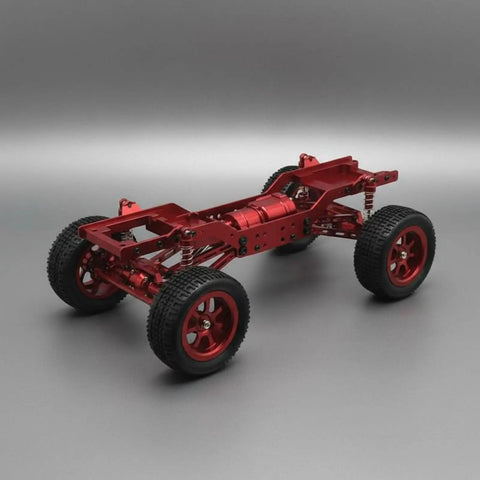 Red 12-Scale RC Aluminum Alloy Chassis Kit For DIY Electric Car Build showing metal frame, wheels, and sturdy gearbox axles.