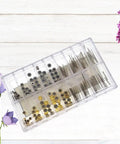 Pro Grade 170Pcs Watch Crown And Spring Bar Replacement Kit with assorted stems, tubes, and pins in plastic case on wooden background.