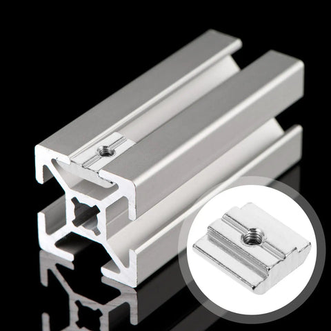 50 Pack T Slot Nuts Carbon Steel Sliding Fasteners For Aluminum Tracks CNC Routers DIY Shop Builds Heavy Duty Drop In Hardware That Stays True No Fuss Workshop Gear, close-up of aluminum extrusion and T slot nut.