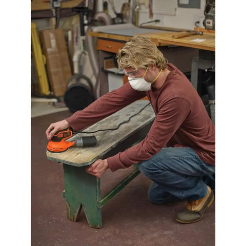 Man using Corded 5 Inch Orbital Sander With Paddle Switch Easy Grip Versatile Paint Prep And Finish Sanding For Woodworking Projects