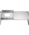 Solo Camping Table In Stainless Steel With Windshield And Heat Shield Portable Tabletop Stove Stand With Storage Bag For Alcohol Stoves Like Trangia Esbit ST 310 ST 340 For Outdoor Trips, showing folding surface and stove support.