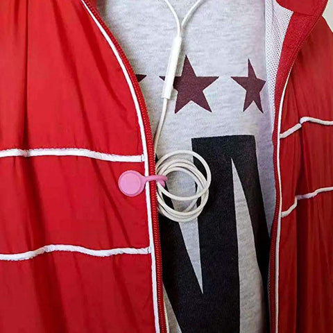 Person wearing red jacket with Must Have Magnetic Cable Clips Set For Tidy Cables And Keychains Ultra Strong Magnets Hold USB Cords