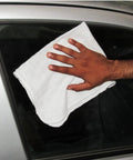 Hand using white cotton towel on car window, from Pack Of 50 Cotton Shop Towels 13 By 14 Inches Absorbent Reusable Cleaning Rags For Auto Shop Garage Home Use Multipurpose White Towels Great For Automotive Detailing Industrial Cleanups And General Cleaning