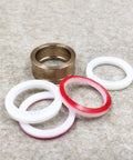Seal assembly for HP waterjet: 1 bronze metal seal ring and 5 white/red gasket rings, 0.875 inch size.
