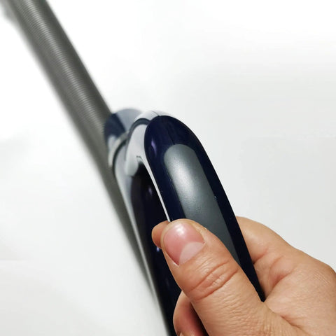Person holding Shark Vacuum Hose Handle Replacement For NV350 NV351 NV352 NV355 NV356 NV357 NV370 High Pile Carpets, dark blue.